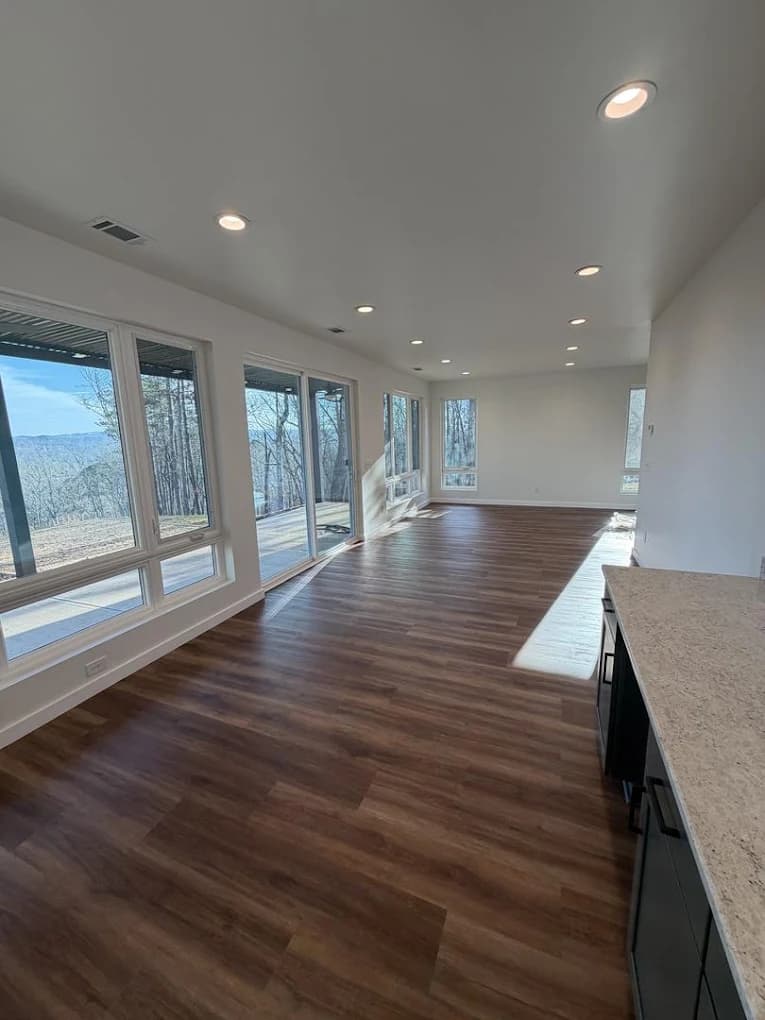 Freshly painted open living space with broad windows