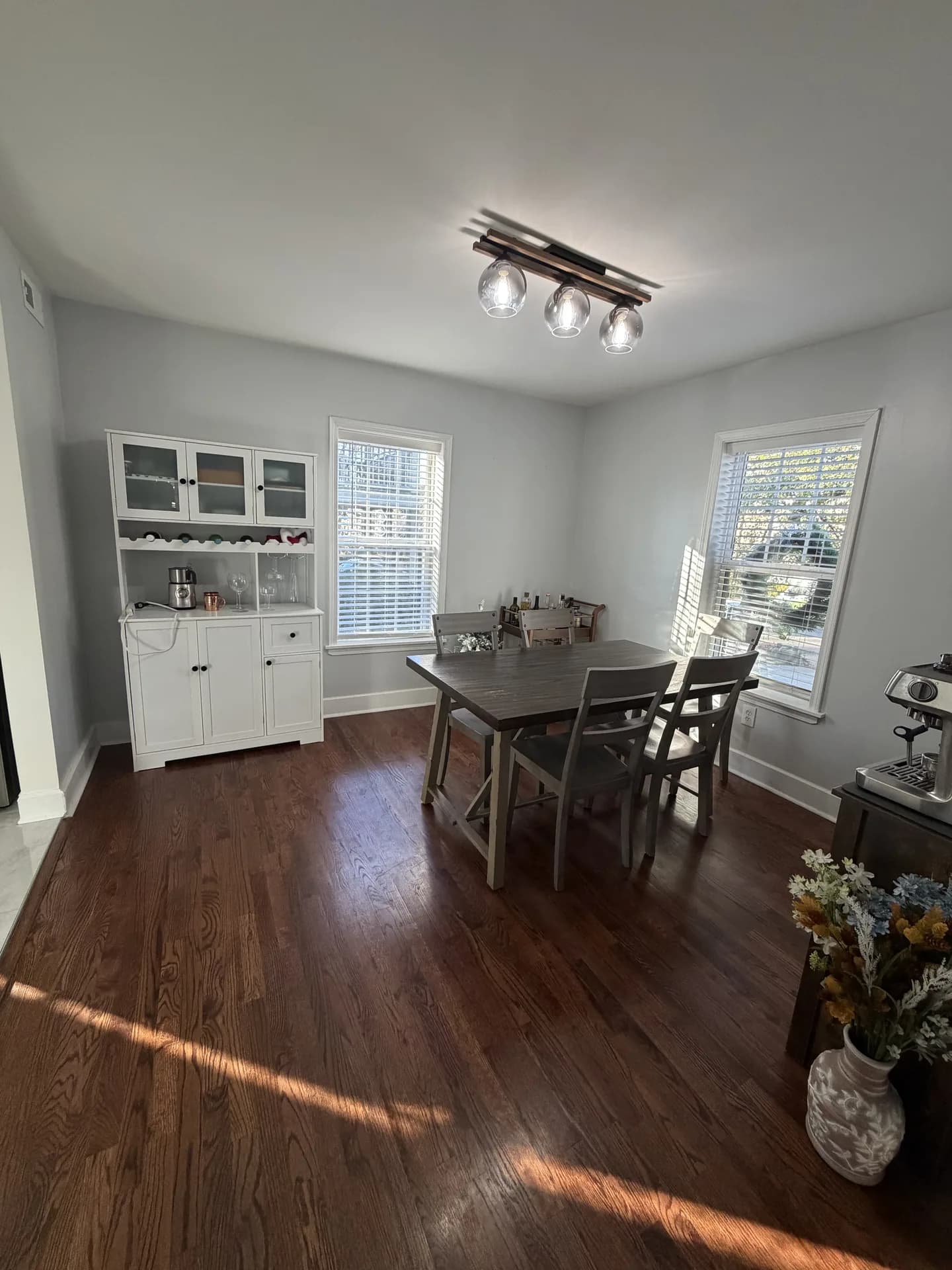 Dining room with freshly painted walls, trim and a white hutch