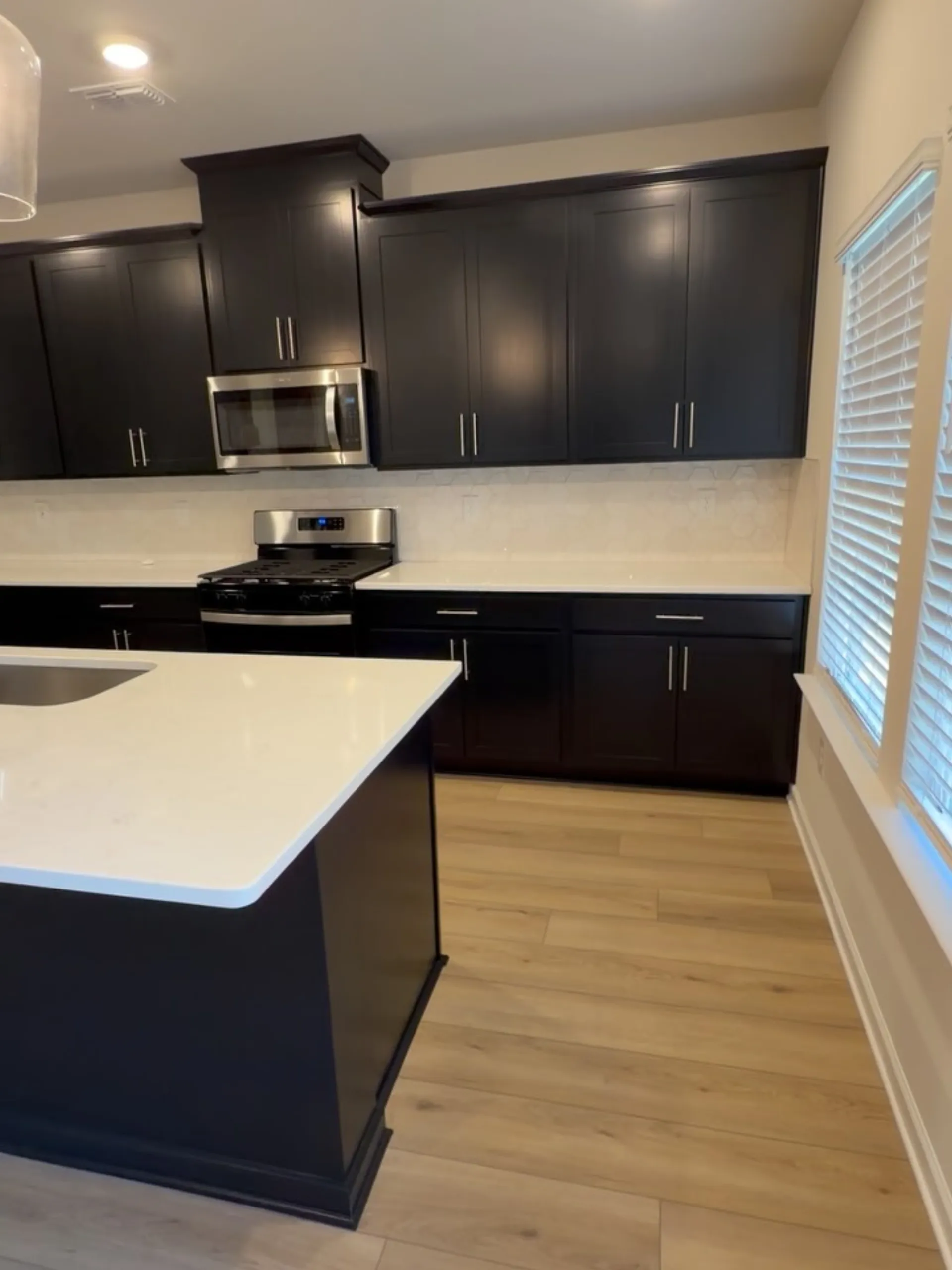 Dark painted kitchen cabinets