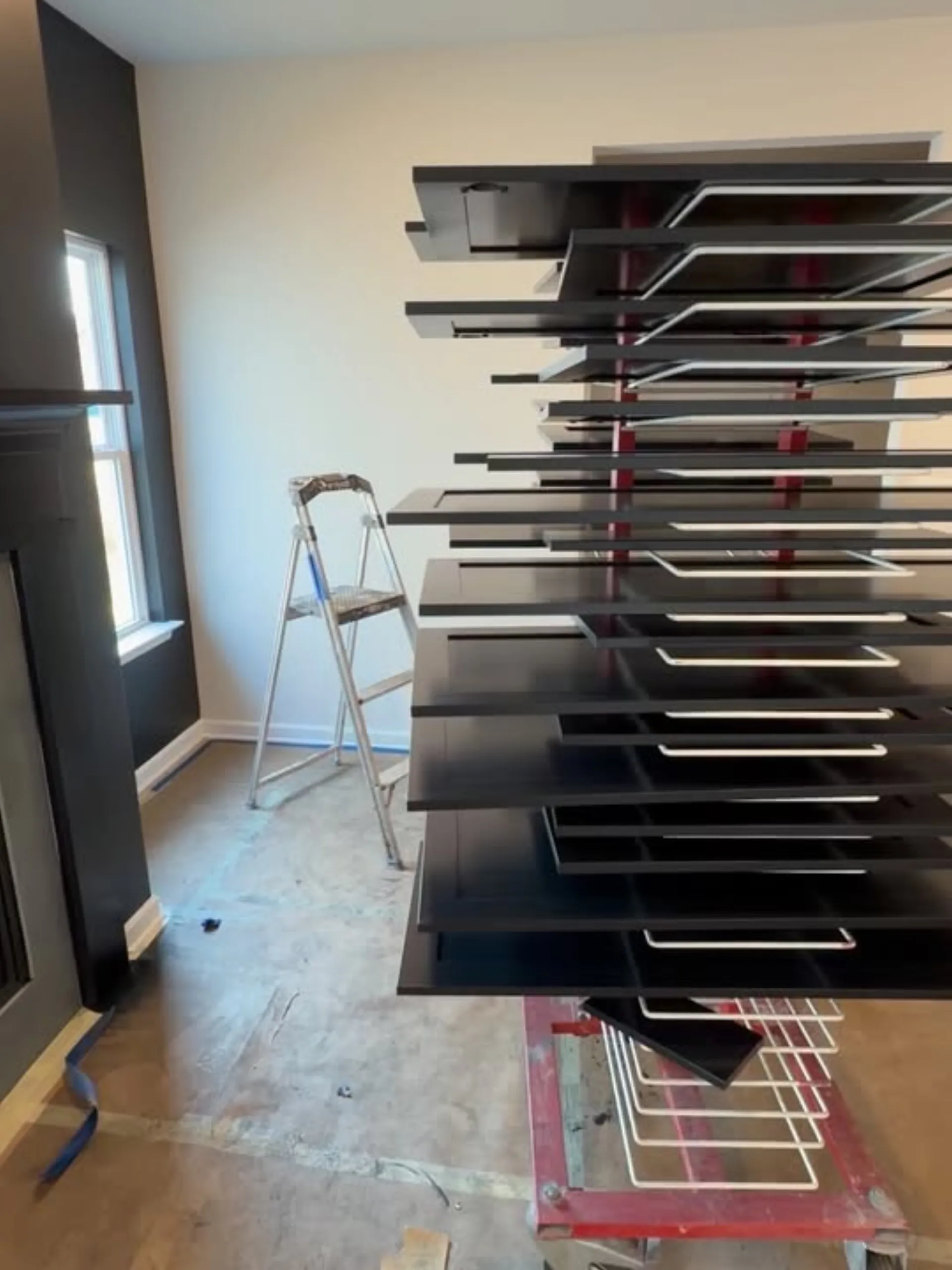 Cabinet doors drying on rack during refinishing